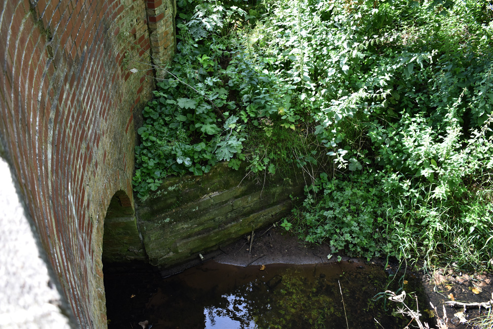 The Brook flows under the Bridge